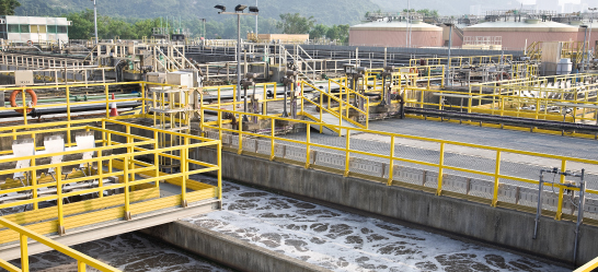 Premier Wastewater & Septic technician performing maintenance on a wastewater treatment facility.